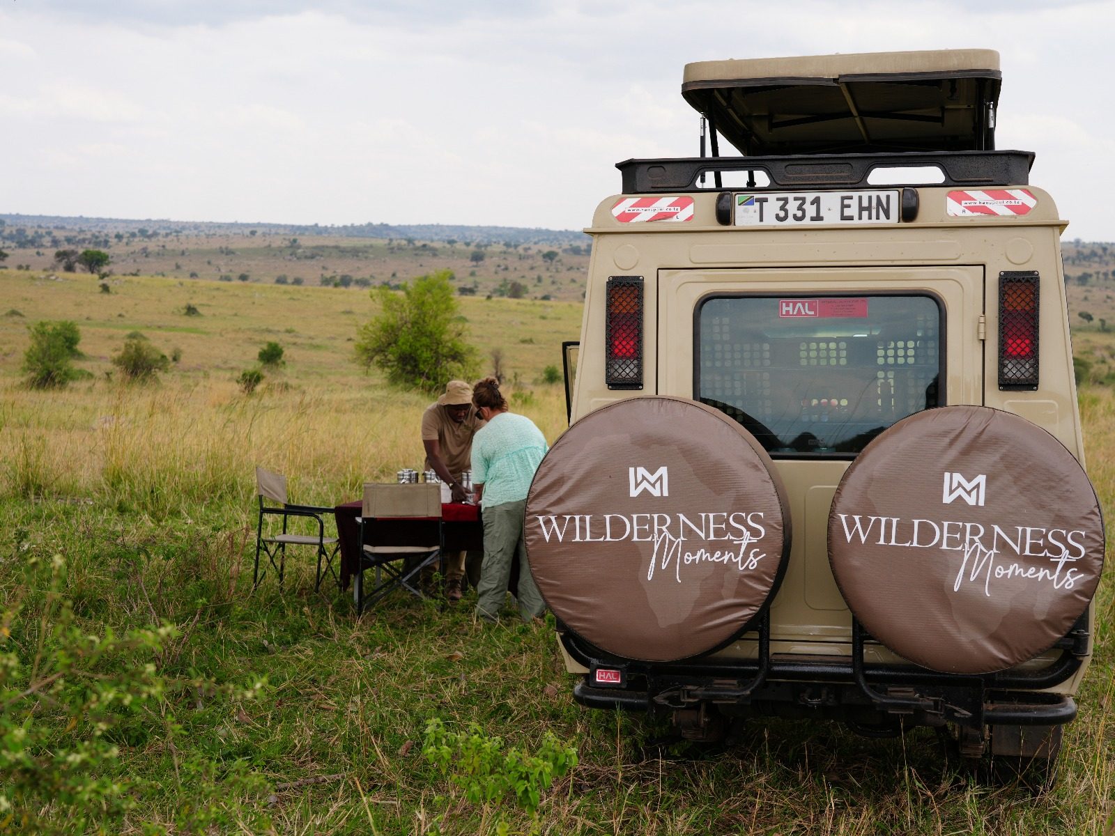 Wilderness Moments safari vehicle and guide on a game drive